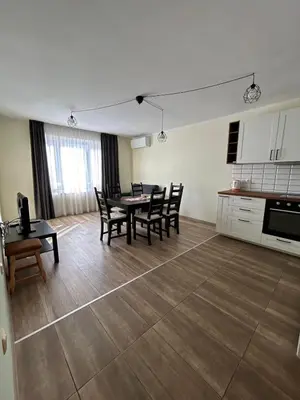 a kitchen and dining room with a table and chairs at Burgas in Burgas City