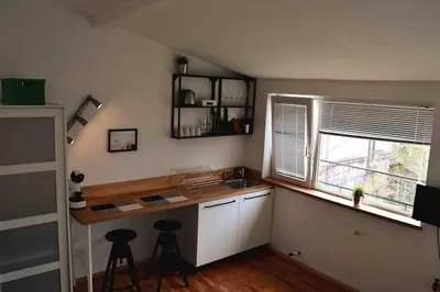 a kitchen with a counter and a sink and a window at Varna Heart Studio in Varna City