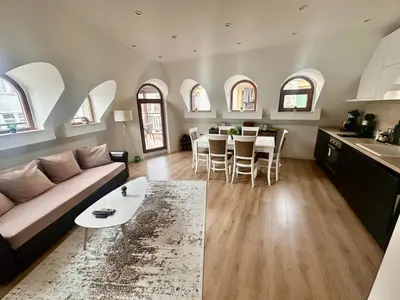 a living room with a couch and a table at Deluxe Apartment Burgas City Centre with Free Parking in Burgas City