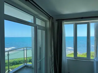 a room with a view of the ocean at Вила Арапя in Tsarevo
