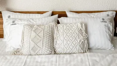 a group of pillows sitting on top of a bed at La Boheme - Adults Only in Obzor
