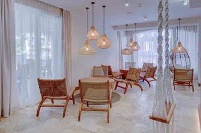 a dining room with a table and chairs and lights at La Boheme - Adults Only in Obzor