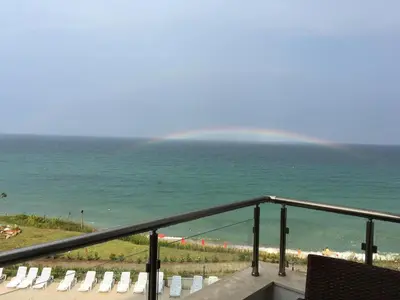a view of the ocean from a balcony at HPManagement Byala Beach Residence Apartments in Byala