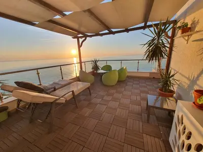 a balcony with a view of the ocean at HPManagement Byala Beach Residence Apartments in Byala
