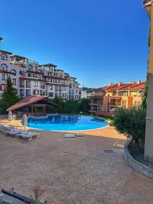 a large swimming pool in front of some buildings at Paradise Dreams Studio in Sveti Vlas