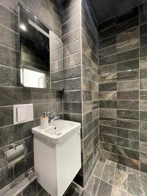 a bathroom with a sink and a mirror at Varna Centre Apartment 2 in Varna City