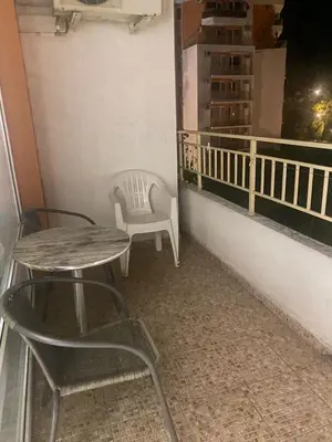 a table and chairs sitting on a balcony at Краун Форт in Sveti Vlas