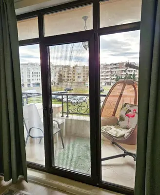 a view of a balcony with a sliding glass door at FOUR SEASONS Beach Apartment in Pomorie
