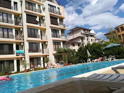 a swimming pool in front of a building at Best Location in Sunny Beach Amber Beach in Sunny Beach