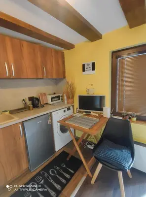 a kitchen with a desk with a computer on it at Tiny House in the center of Varna in Varna City