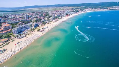 an aerial view of a beach with a boat in the water at Marvel Delux Private Studio in Sunny Beach
