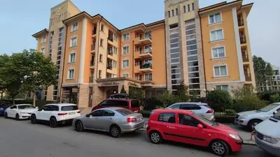 a group of cars parked in front of a building at Marvel Delux Private Studio in Sunny Beach