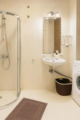 a bathroom with a sink and a washing machine at Marvel Delux Private Studio in Sunny Beach