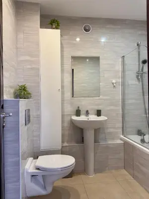 a bathroom with a toilet and a sink and a shower at Garden Villa 2 Bedroom Villa with pool near to Sunny beach in Aleksandrovo
