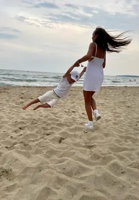 a man and a woman on the beach at Sun Wave Apartment near the Sea in Sveti Vlas