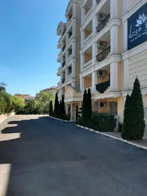 a parking lot in front of a large building at Villa Sardinia Sveti Vlas Studio in Sveti Vlas