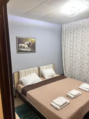 a bedroom with a bed with towels on it at Sea Home in Sunny Beach