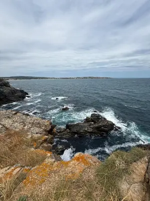 a large body of water with rocks and the ocean at Sea Home in Sunny Beach