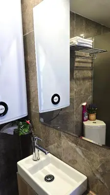 a bathroom with a sink and a mirror at Morava 1 Asparuhovo Beach Holiday House in Varna City