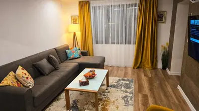 a living room with a couch and a table at Morava 1 Asparuhovo Beach Holiday House in Varna City