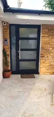 a front door of a house with a plant at Morava 1 Asparuhovo Beach Holiday House in Varna City