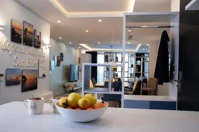 a bowl of fruit on a counter in a room at Sea Bliss in Burgas City