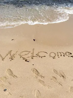 a word written in the sand on a beach at Stamopolu Lux ground floor in Primorsko