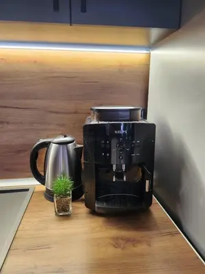 a coffee maker sitting on a counter in a kitchen at Апартамент 8 in Varna City