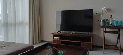 a living room with a flat screen television on a table at Barcelo Royal Beach in Sunny Beach