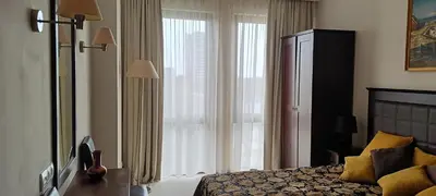 a bedroom with a bed and a large window at Barcelo Royal Beach in Sunny Beach