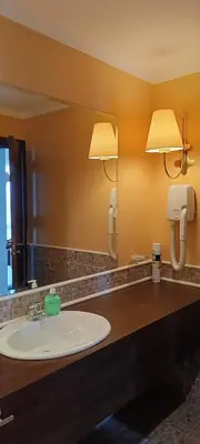 a bathroom with a sink and a mirror at Barcelo Royal Beach in Sunny Beach