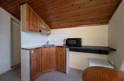 a small kitchen with a sink and a microwave at Citybox - Shipka in Varna City