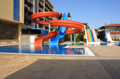 a water slide in a pool in a hotel at Tiara Beach - All Inclusive in Sunny Beach