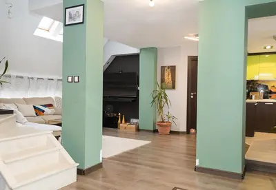 a living room with green and white walls at Modern 2-Level Apartment with Balcony in Varna by Flat Mаnager in Varna City