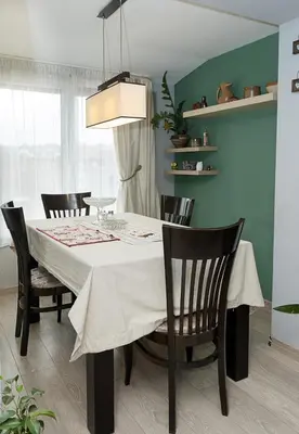 a dining room table with chairs and a white table cloth at Modern 2-Level Apartment with Balcony in Varna by Flat Mаnager in Varna City