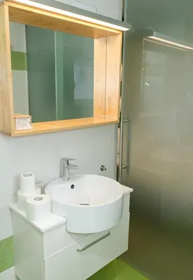 a bathroom with a sink and a mirror at Modern 2-Level Apartment with Balcony in Varna by Flat Mаnager in Varna City