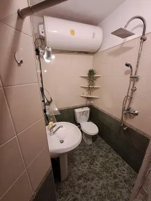 a bathroom with a toilet and a sink at Varna city breaks 1 in Varna City