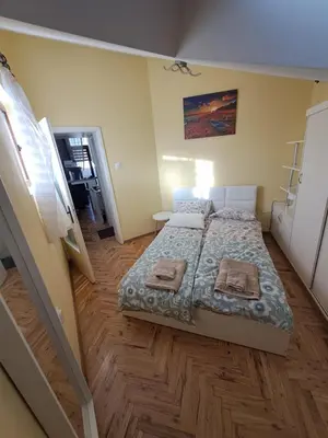 a bedroom with a bed with two towels on it at Varna city breaks 1 in Varna City
