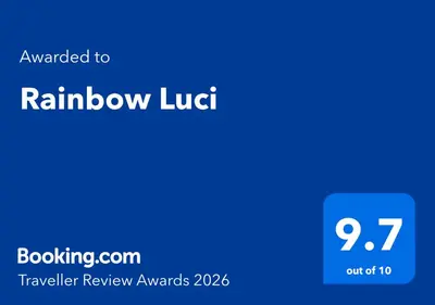 a blue sign with the words rainbow lirt on it at Rainbow Luci in Sunny Beach