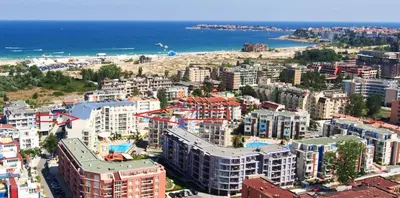 an aerial view of a city with a beach and buildings at Rainbow Luci in Sunny Beach