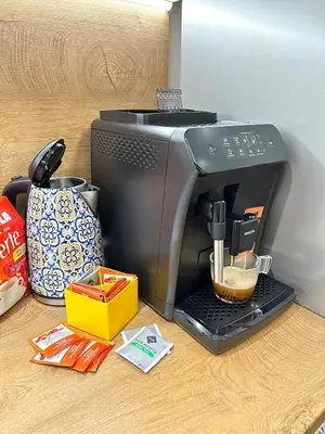 a black coffee maker sitting on a counter at Varna Hidden Gem in Varna City