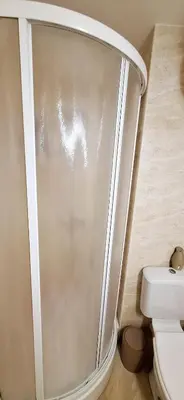 a shower stall in a bathroom with a toilet at Studio M in Sveti Vlas