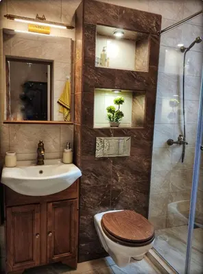 a bathroom with a toilet and a sink and a shower at Casa Soleada in Bliznatsi