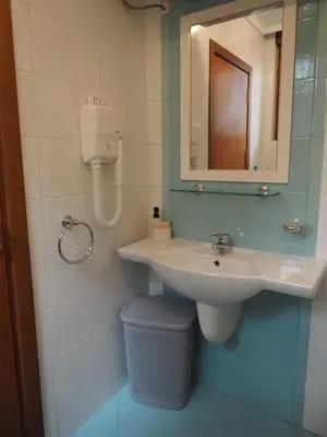 a bathroom with a sink and a mirror at Studio Sea Breeze Veranda in Santa Marina in Sozopol