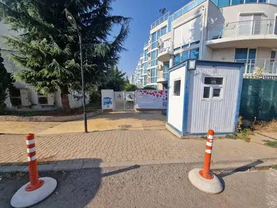 two orange and white cones in front of a building at Апартамент БАНГЕВИ in Burgas City