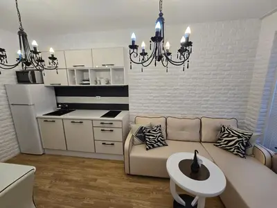 a living room with a couch and a table at Romans Marin in Sunny Beach