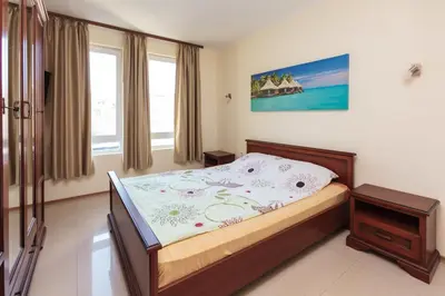 a bedroom with a bed in a room at Apartment Patriarh Evtimiy in Burgas City