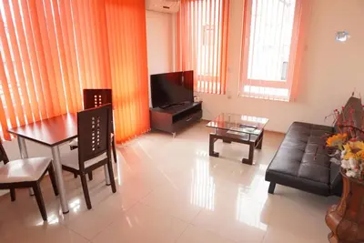 a living room with a couch and a table at Apartment Patriarh Evtimiy in Burgas City
