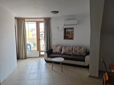 a living room with a couch and a table at Apartment Lermontov in Burgas City