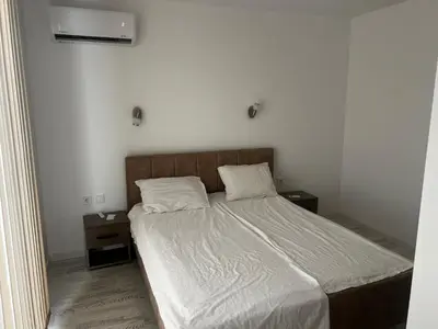 a bed with two pillows on it in a bedroom at Obzor in Obzor